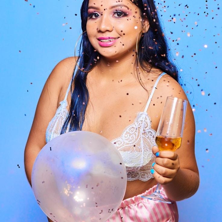 Alex Doe, Lead Design Curator at RidgeQuillMeadow, reviewing corporate floral arrangements